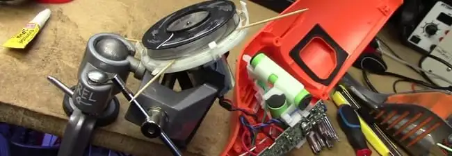 Vacuum cleaner repair parts and tools on a workbench in Austin, TX
